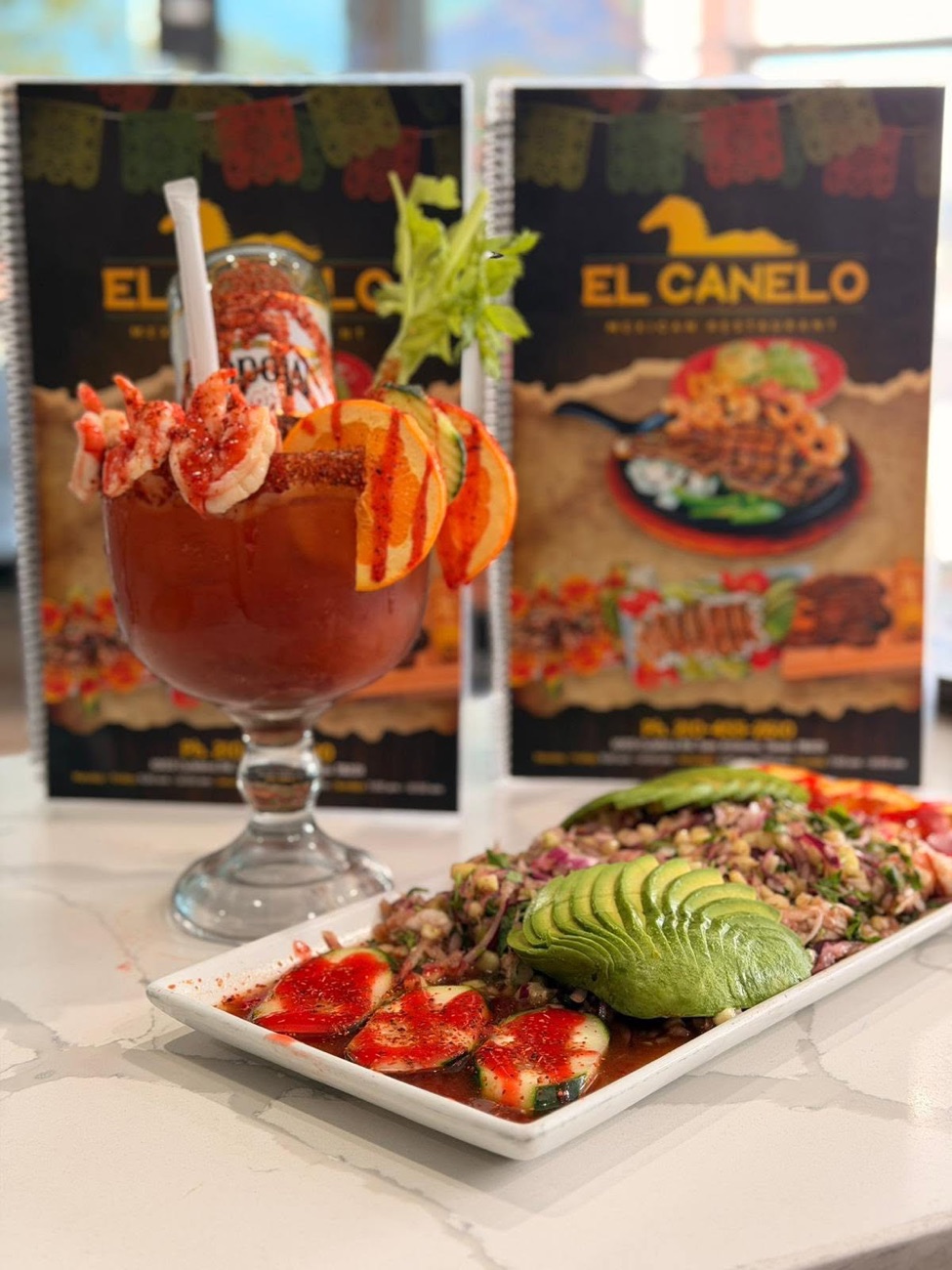 Michelada El Canelo — shrimp-rimmed beer cocktail with aguachile platter
