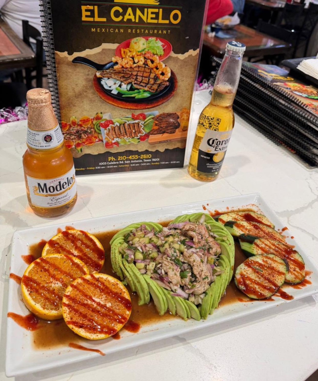 Tuna aguachile with avocado and Modelo beers