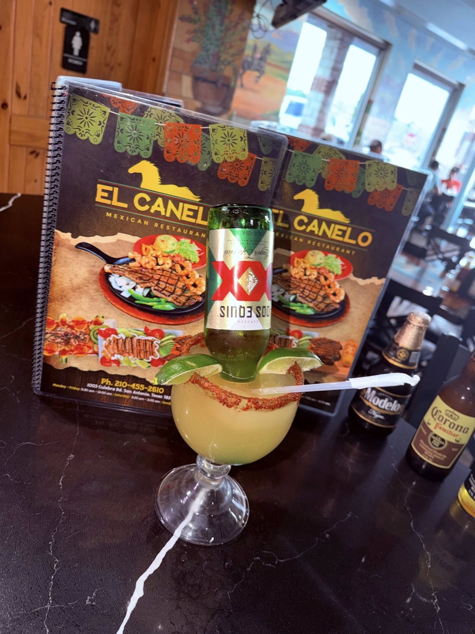 Frozen margarita with Dos Equis — on the cantina counter